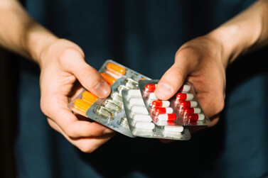 Man holding medicines Man holding medicines